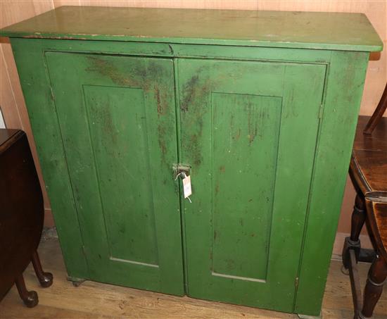 A Victorian painted pine two door cabinet W.110cm